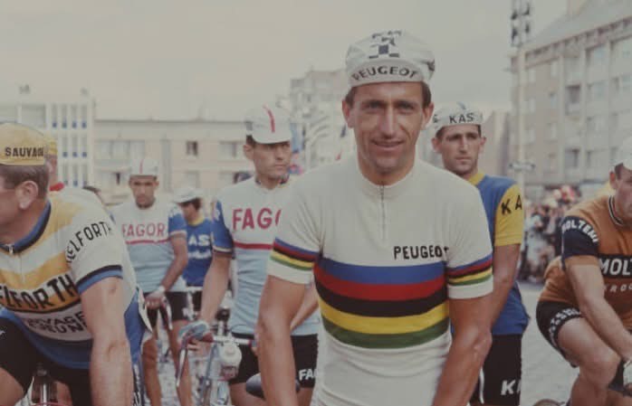 Historic photograph of British cyclist Tom Simpson wearing the world champion's rainbow jersey, featured on the SIXTY/8 Bike Box Tom cycle box hire page.